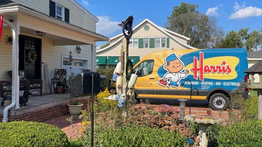 Harris van parked out front during a water heater service.