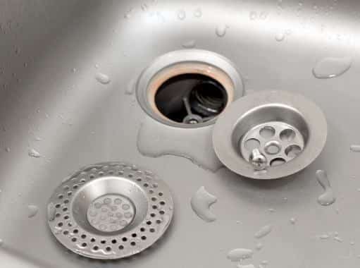 A sink in Delaware with a disassembled protective filter ready for draining | Delaware Drain Services | Call Harris Now