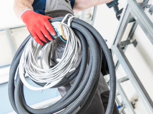 A electrician in New Jersey preparing electrical wires and pipes | New Jersey Electrical Services | Call Harris Now