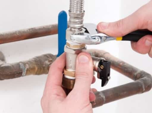 A plumber in New Jersey fixing a water line | New Jersey Drain Services | Call Harris Now