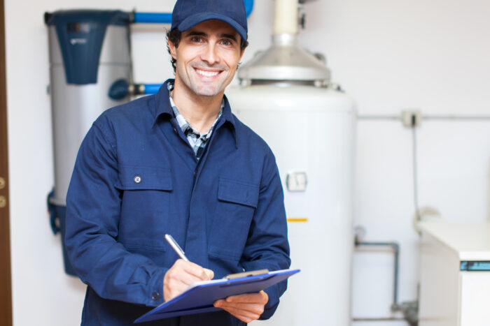 Technician servicing a boiler.