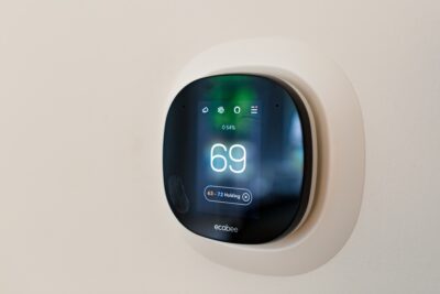 digital thermostat set to 69 degrees.