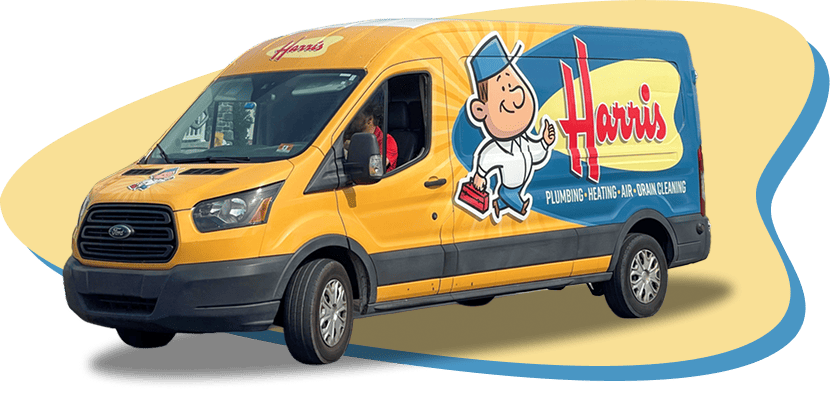 Harris plumbing van: yellow delivery van with blue side panel, cartoon mascot, and 'Plumbing • Heating • Air • Drain Cleaning' branding